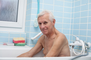 Happy senior man in bath