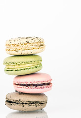 Stack of four macaron cookies with white background