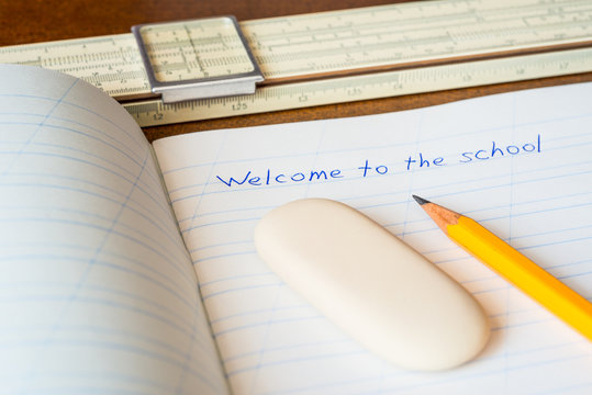 Welcome to the school, an exercise book and pencil with eraser 