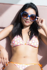 sunbathing woman in bikini