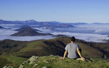 Fototapeta na wymiar Man enjoying the landscape, Basque country.