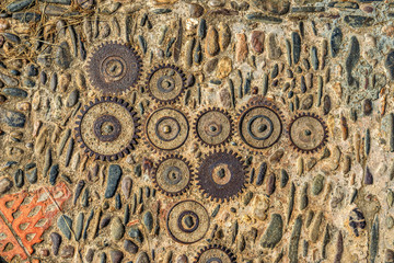 Pavement texture with gears and bricks in Montjuic, Barcelona, S