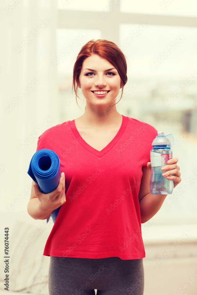 Sticker smiling girl with bottle of water after exercising