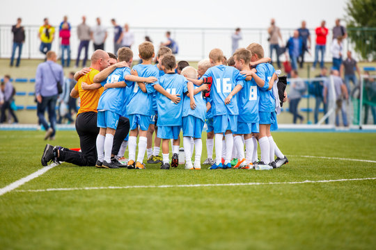 Fototapeta Football match for children. shout team, soccer game