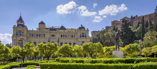 Fototapeta na wymiar Pedro Luis Alonso gardens and the Town Hall building in Malaga,