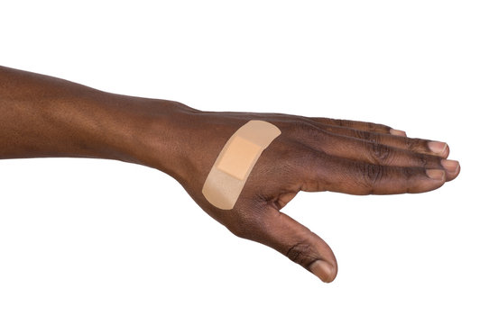 Hand with adhesive bandage