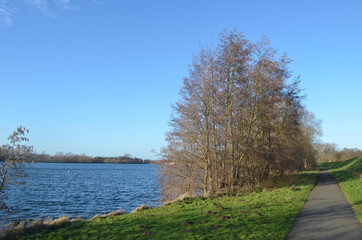 Bicycle trail on shore of lake Egleghem