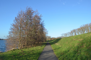 Bicycle trail on shore of lake Egleghem