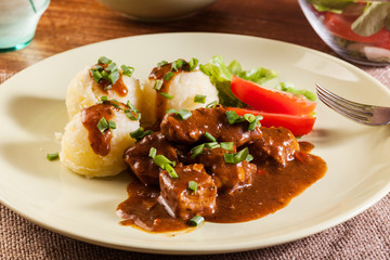 Goulash with boiled potatoes