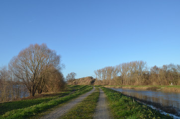 Fototapeta na wymiar Walking path on dike along river Zenne