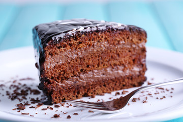 Delicious chocolate cake on plate on table close-up
