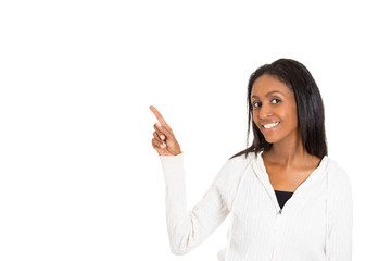 smiling middle aged woman pointing finger at blank copy space