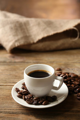 Cup of coffee on wooden table