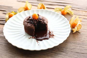 Hot chocolate pudding with fondant centre on plate, close-up