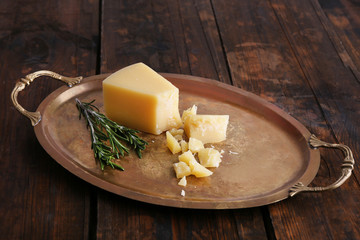 Crumbles Parmesan cheese with sprig of rosemary