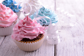 Delicious cupcakes on table close-up