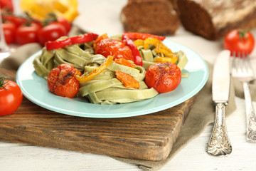 Tasty pasta with pepper, carrot and tomatoes