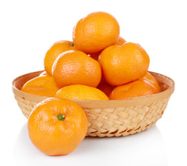 Tangerines in basket isolated on white