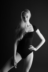 Beautiful woman posing in a black leotard