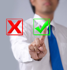 Close up businessman touching ticking icon of media screen