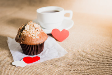 chocolate muffin and coffee and hearts on sackcloth textures