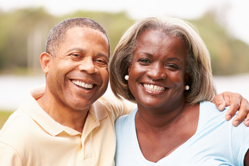 Portrait Of Happy Senior Couple In Garden