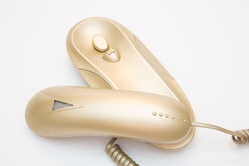 gilded home phone on white background
