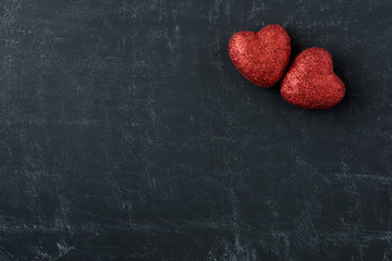 Obraz premium Red Hearts on a Chalkboard for Valentines Day
