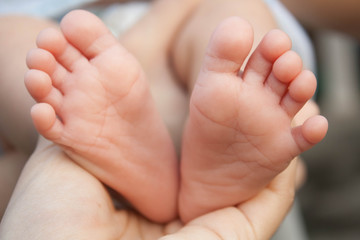 Obraz na płótnie Canvas The baby feet