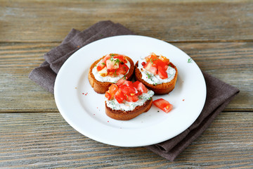 Three bruschetta with tomatoes