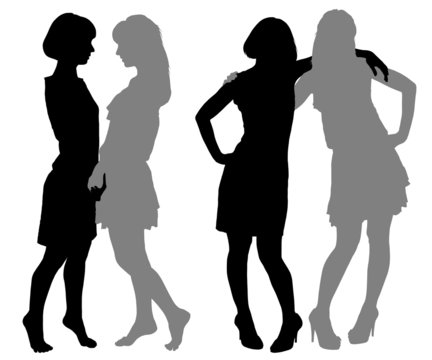 silhouette of two young women