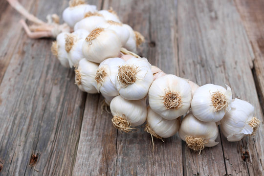 garlic brunch closeup wood old background rustic