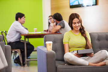 Woman Sitting On Sofa And Working In Design Studio