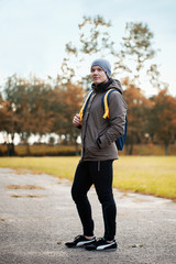 the young guy came to stadium with a backpack on training