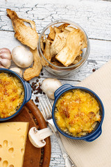 Moshroom casserole in a blue ceramic pot