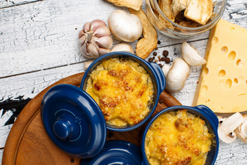 Moshroom casserole in a blue ceramic pot