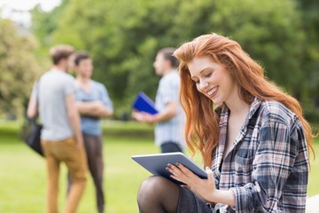 Pretty student studying outside on campus