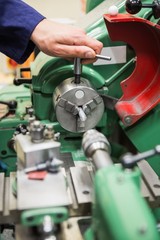 Engineering student using heavy machinery