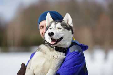 Happy man with a husky © castenoid