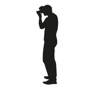 Vector silhouette of a photographer who takes pictures