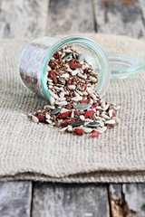 Seed mix with goji berries on a rustic background