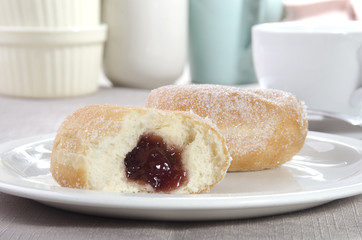 baked donut with sugar on a plate