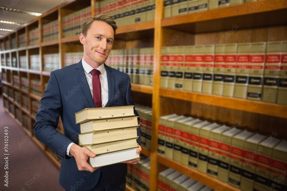 Wall mural Handsome lawyer in the law library