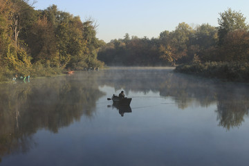 morning landscape with fishermen on the river