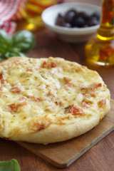 Pizza with cheese and tomatoes