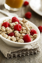 Breakfast table with bran, berries and juice