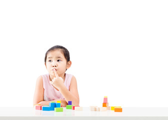 Thinking little girl isolated on white background