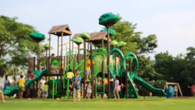 children play on the playground in Thailand park.
