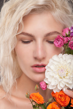 Blonde woman with flower