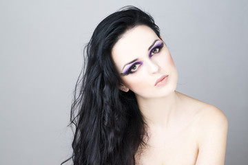 Naklejka premium Professional makeup and hairstyle beautiful young woman close up